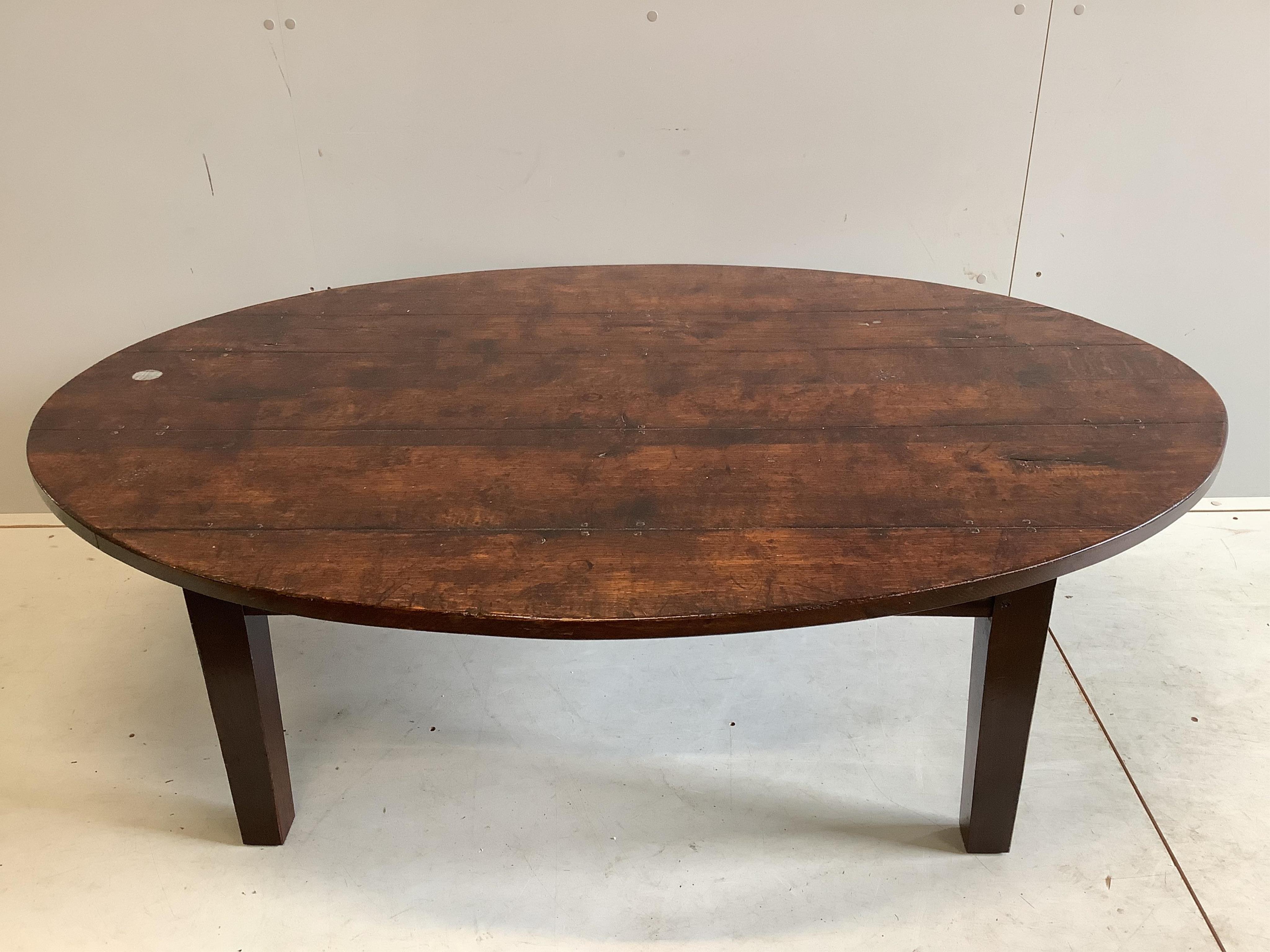 An 18th century style oval oak coffee table, width 146cm, depth 100cm, height 50cm. Condition - good